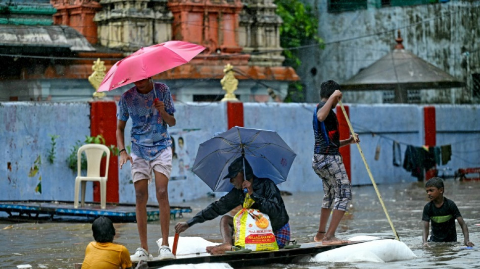 India issues flood warnings as rain pounds south