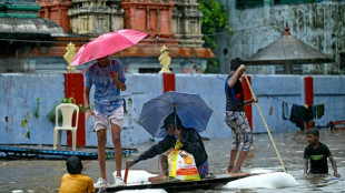 India issues flood warnings as rain pounds south