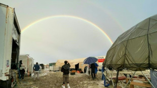 Thousands stuck in mud at Burning Man festival, one dead