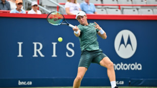 Rain break sparks Ruud's rally past Bautista Agut