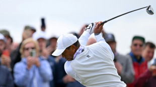 Tearful Woods set to miss British Open cut