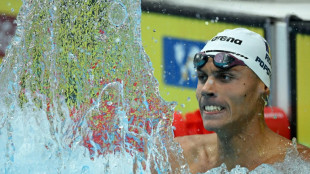 Youngster Popovici, veteran Ledecky take glory in swimming worlds