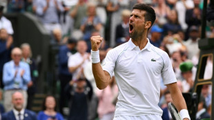 Djokovic battles from two sets down to reach 11th Wimbledon semi-final