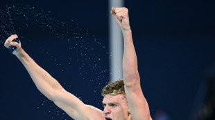 Swim star Marchand wins fourth Paris gold as boxing row hits Olympics
