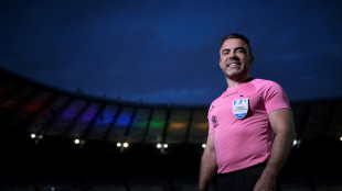 Removing 'camouflage,' Brazil football referee comes out