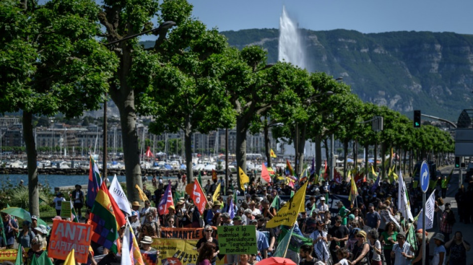 Protesters march in Geneva against WTO role in agriculture