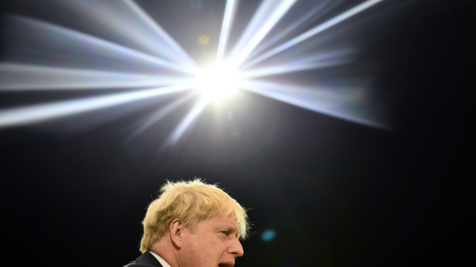 UK's wounded Johnson presses on despite Tory rebellion