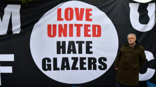 Man Utd fans take aim at the Glazers in protest march