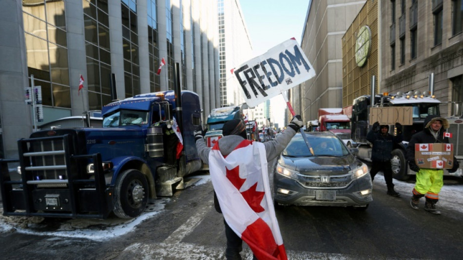 Canada provinces move to ease Covid rules as trucker protest hardens