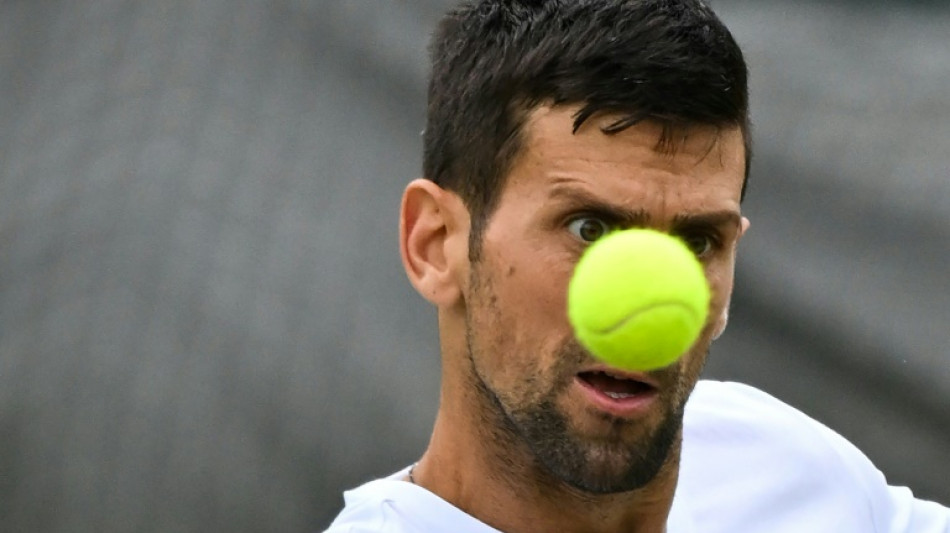 Djokovic eyes Wimbledon glory after Nadal pulls out 