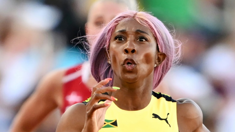 Fraser-Pryce coasts into world 200m final