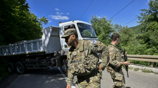 Kosovo Serbs dismantle barricades at Serbia border
