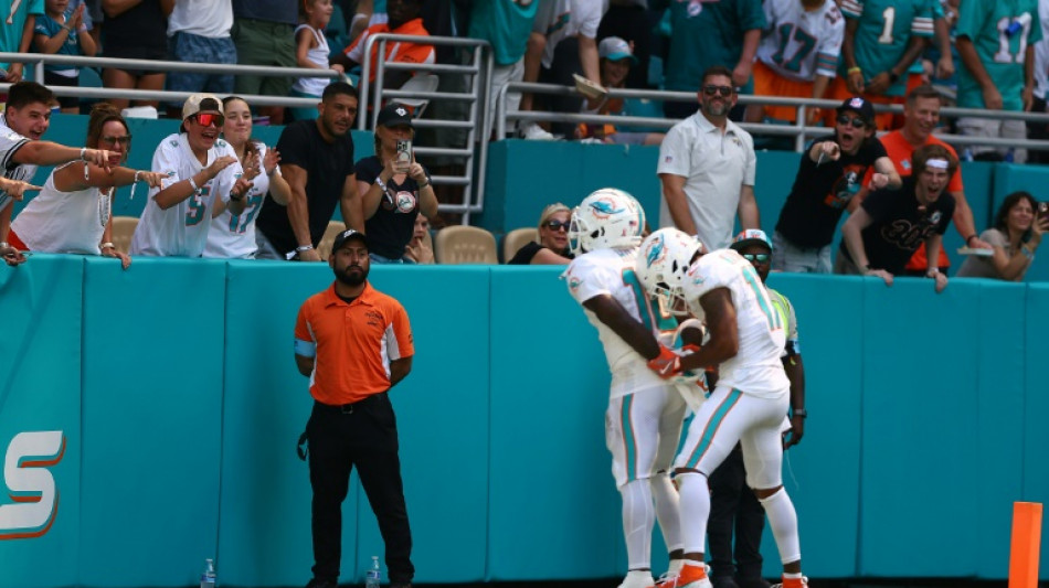 Hill sparks Dolphins comeback in wild NFL opening day